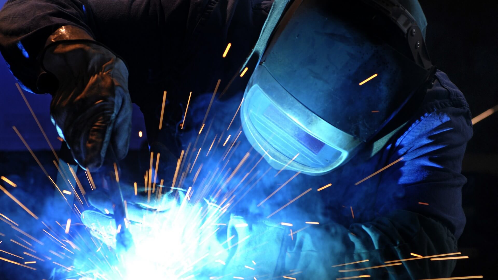 worker while doing a welding with arc welder